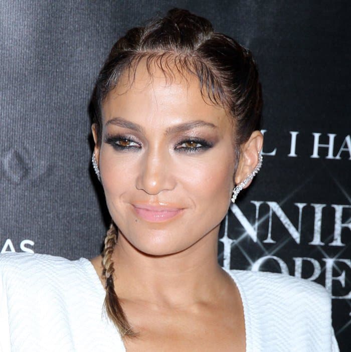 At her residency launch party, Jennifer Lopez's hair was styled in a sleek, braided ponytail