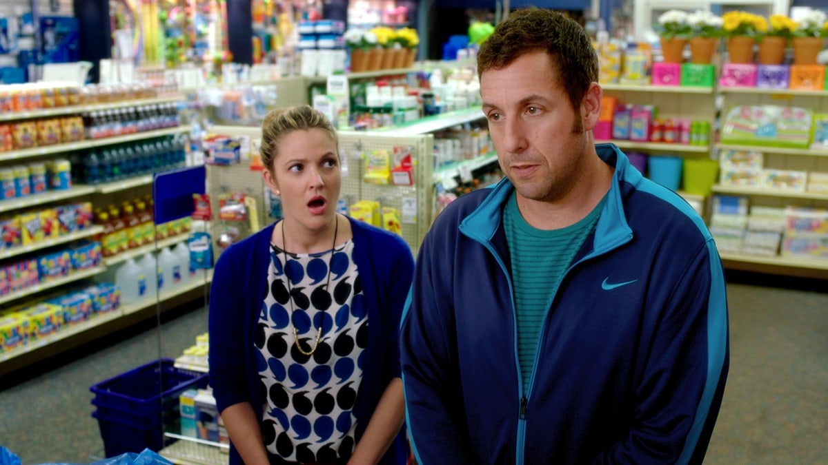 Drew Barrymore and Adam Sandler share an awkwardly funny moment as single parents on a blind date in Blended (2014), their third romantic comedy collaboration after The Wedding Singer and 50 First Dates