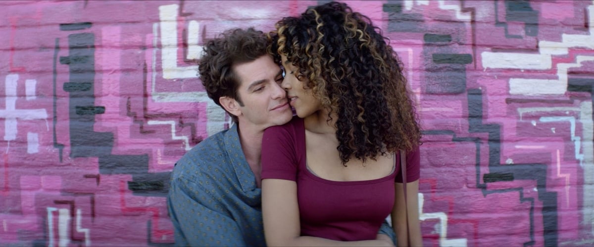 Andrew Garfield as Jonathan Larson and Alexandra Shipp as Susan Wilson share a romantic moment in the film Tick, Tick… Boom!
