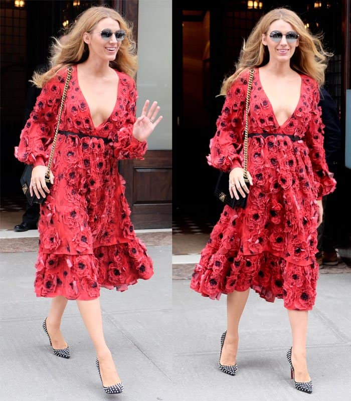 Blake Lively radiates confidence in a bold red floral-appliqué dress from Michael Kors Spring 2016, styled with Christian Louboutin studded Pigalle pumps, a Chanel Boy bag, Michael Kors Kendall II sunglasses, and Lorraine Schwartz jewelry while leaving her New York City hotel on February 17, 2016
