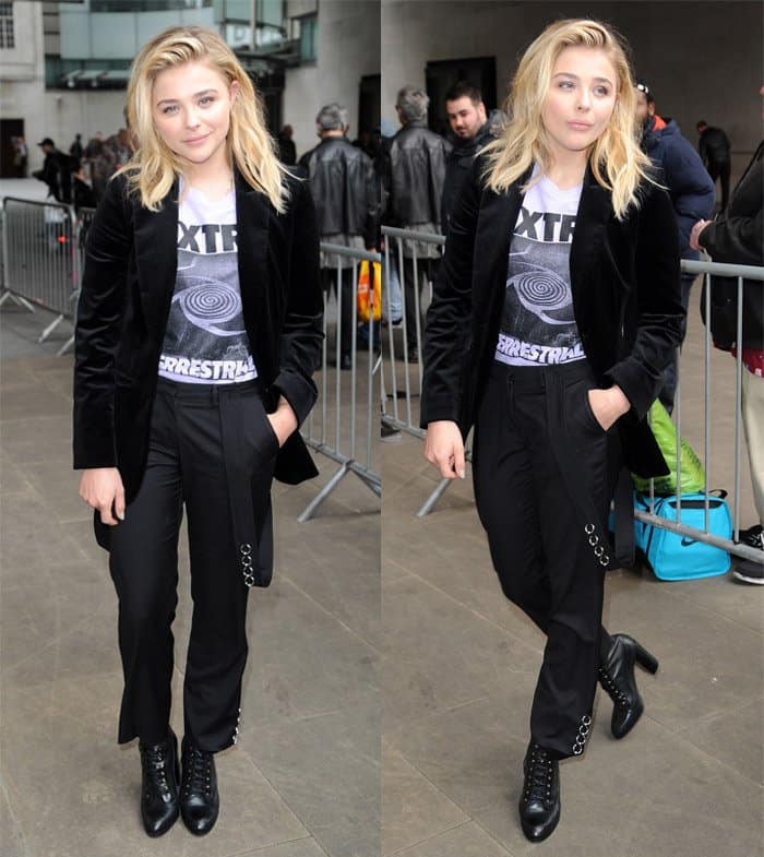 Chloë Grace Moretz exudes a stylish, edgy vibe in her Mugler Pre-Fall 2016 suspender pants, extraterrestrial graphic t-shirt, Belle Freud "Willoughby" black velvet jacket, and lace-up booties