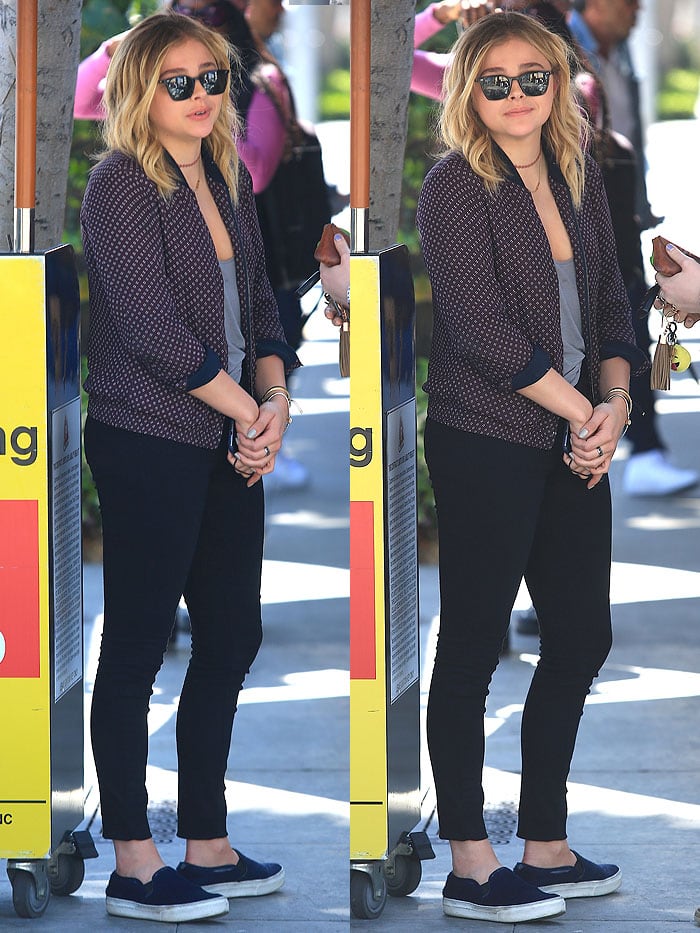 Chloë Grace Moretz wears a bomber jacket and skinny jeans while out for lunch in Beverly Hills
