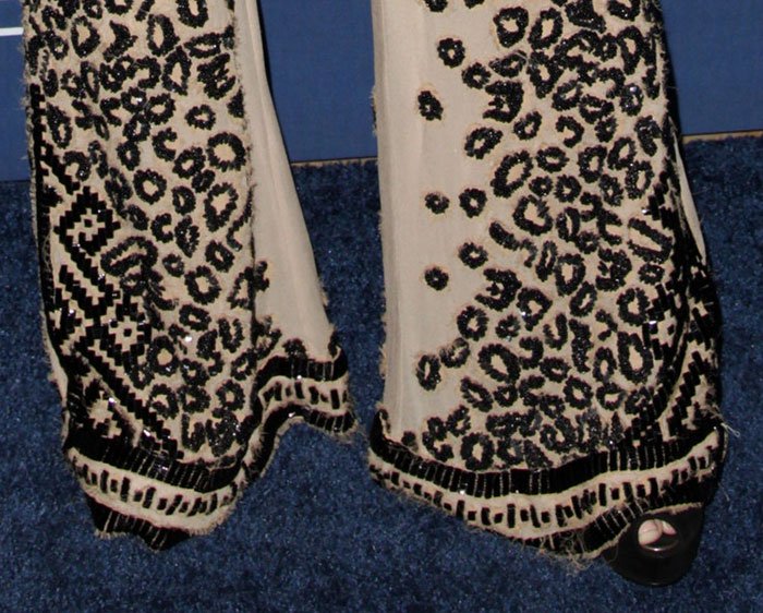 Partially concealed beneath her floor-grazing flares, Demi Lovato's black patent leather Louis Vuitton "Oh Really!" pumps added height and polish to the statement-making look