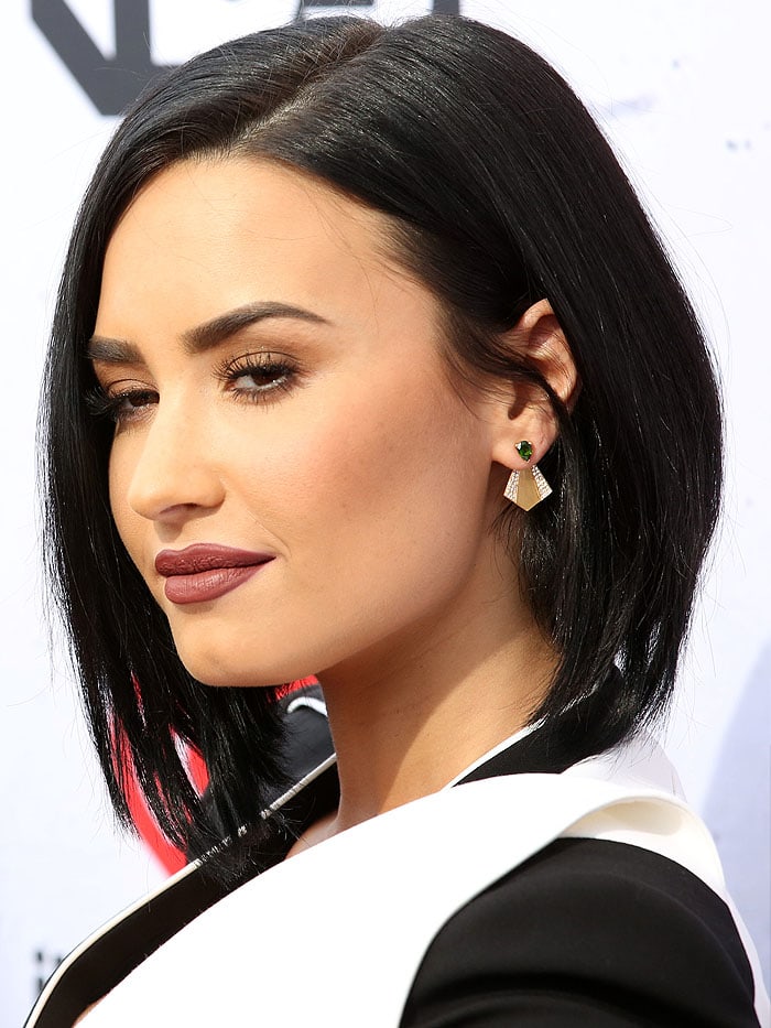 Demi Lovato shows off her Ileana Makri fan stud earrings