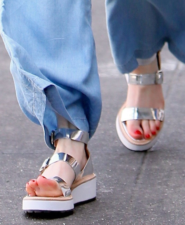 Emma Roberts's feet in metallic Loeffler Randall sandals