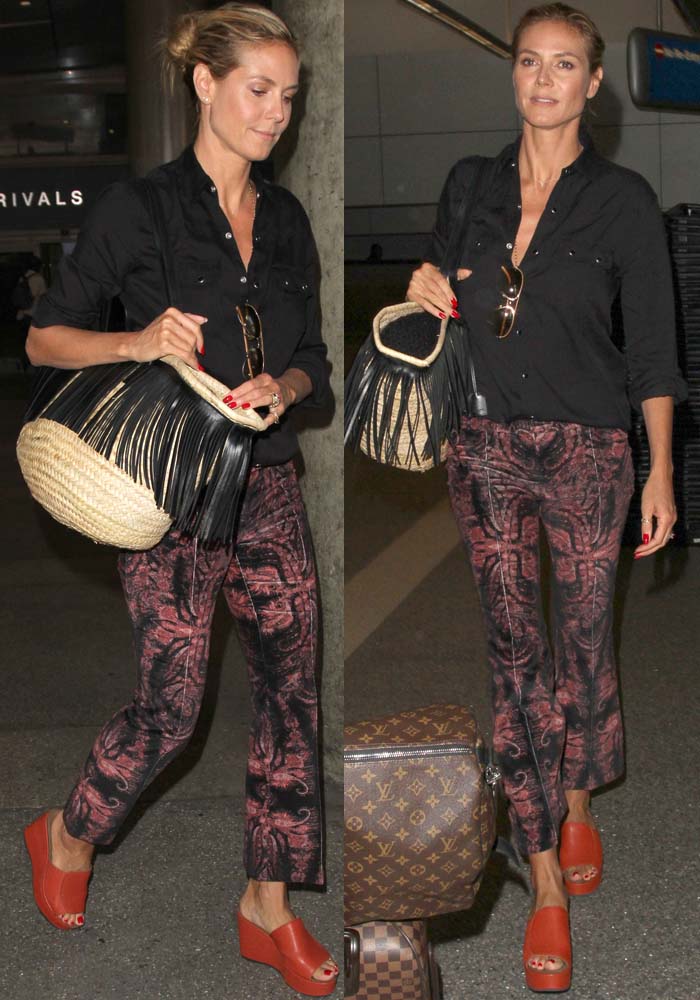 Heidi Klum arrives at the airport in a casually thrown-together outfit and a pile of Louis Vuitton luggage