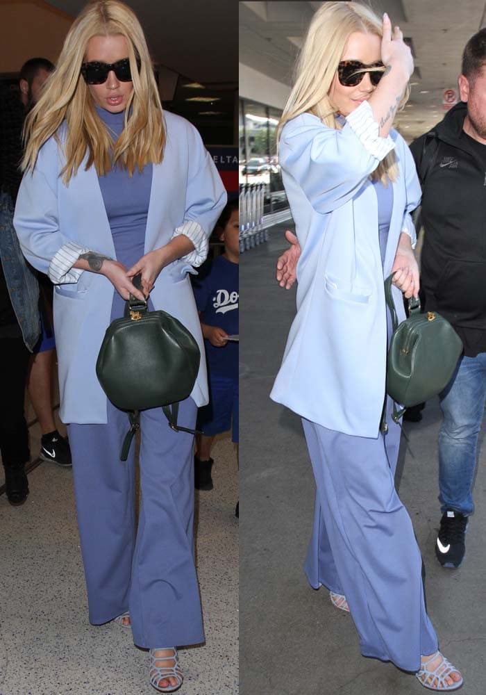 Iggy Azalea in a jumpsuit with a high neck and wide leg pants