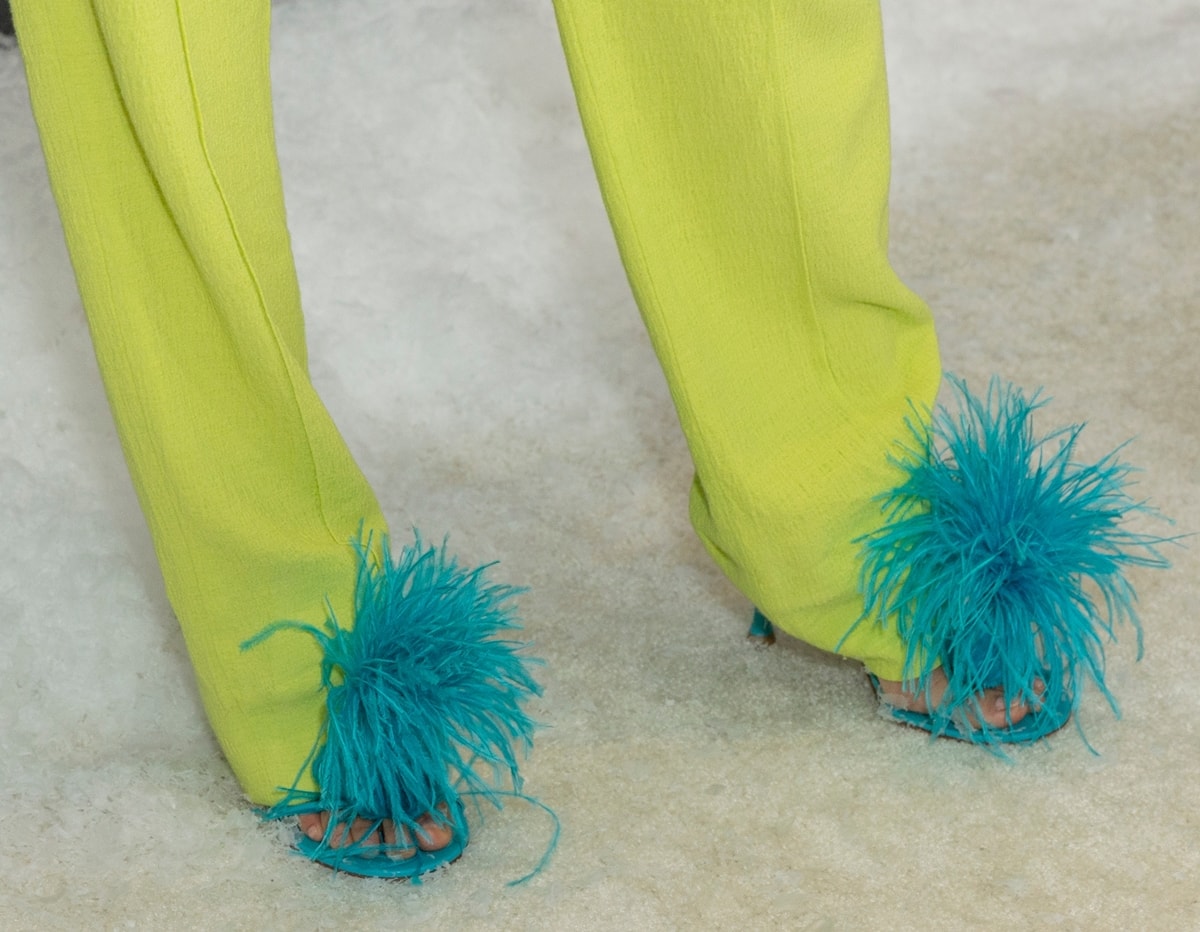 Jamie Chung added a playful pop of color with turquoise Bottega Veneta Dot feather-trimmed leather sandals at the Dexter: New Blood premiere in New York City