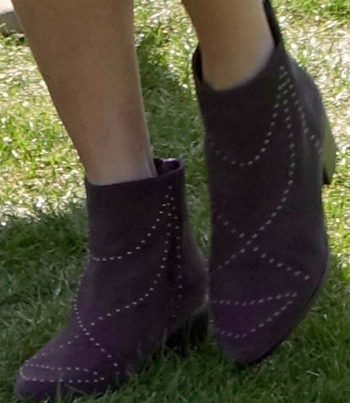 Jamie Chung completed her Coachella look with studded suede “Wendy” ankle boots by Grey City, adding a touch of edge to her festival-ready outfit
