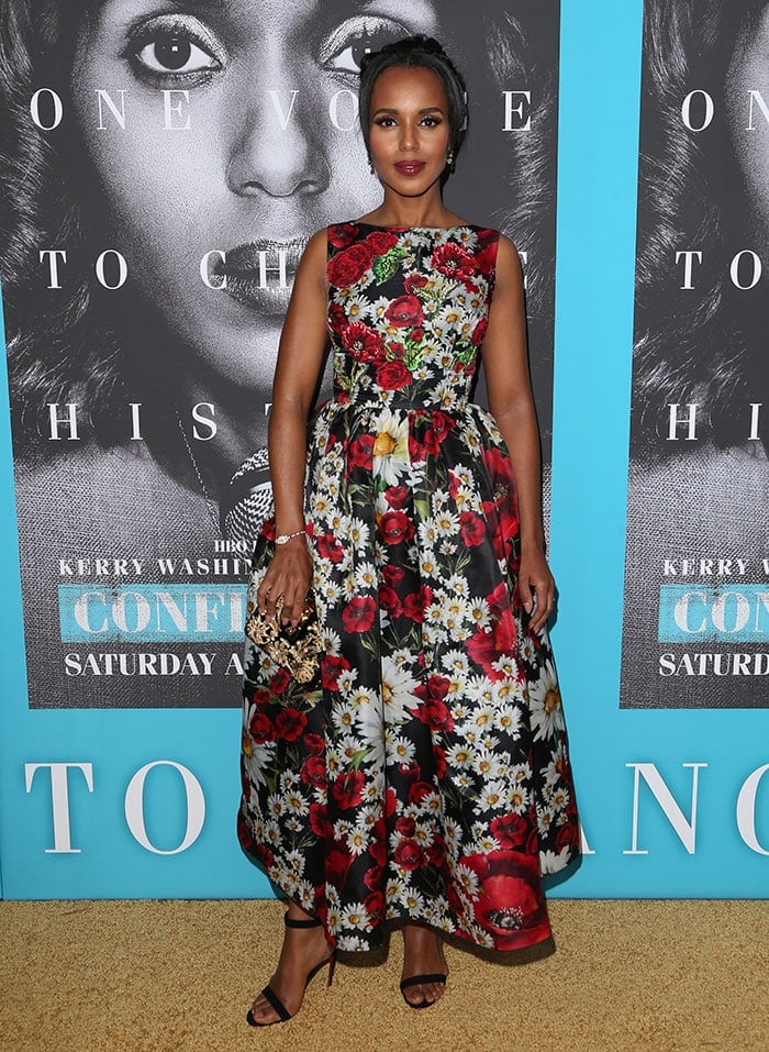 Kerry Washington makes a striking entrance at the Confirmation premiere in a full-skirted Dolce Gabbana floral gown, pairing the bold print with minimal black ankle-strap heels for a clean, lengthening finish