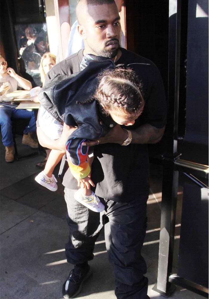 Kanye carries North out as the family leaves The Cheesecake Factory for lunch