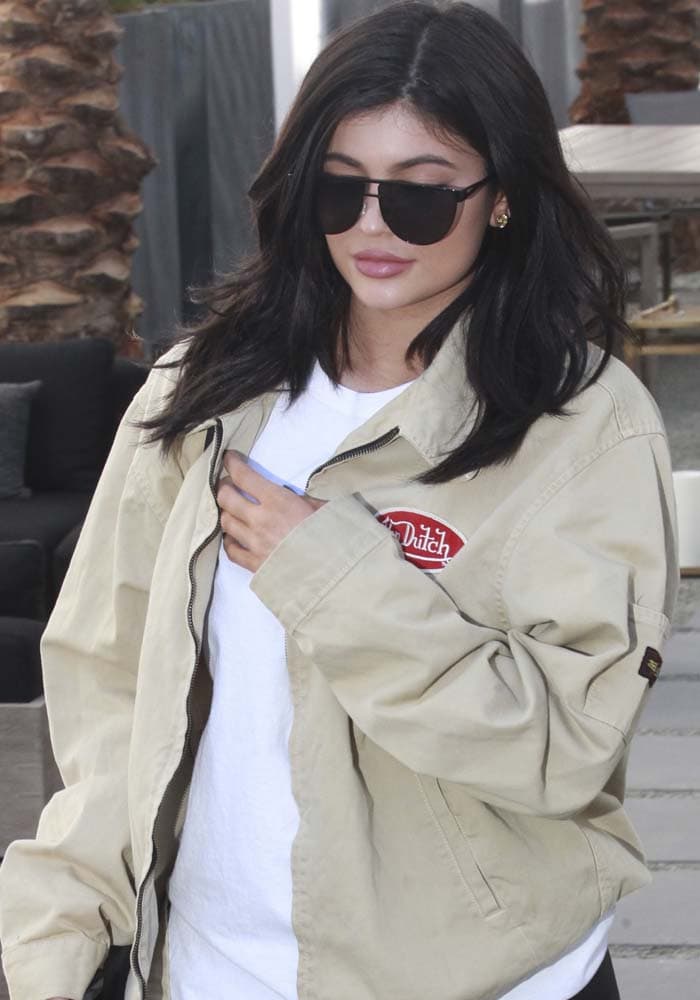 Kylie Jenner kept her look casual-chic in a vintage-inspired Von Dutch jacket and oversized sunglasses