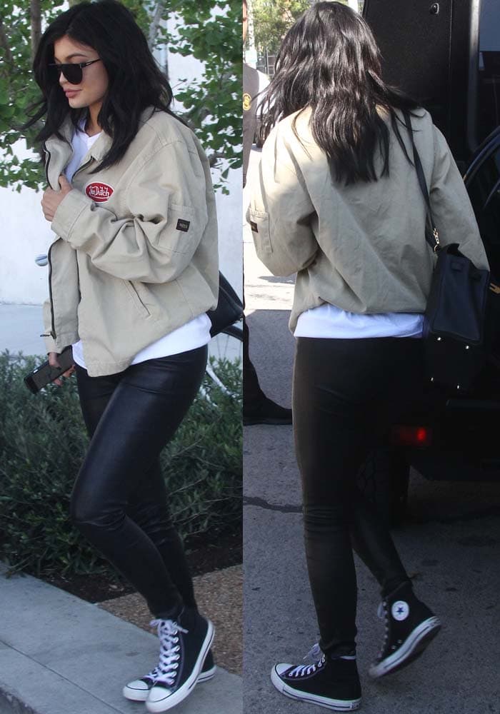 She balanced the boxy jacket with sleek leather J Brand skinnies and her go-to Converse high-tops