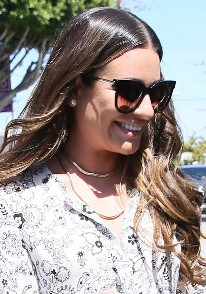 Lea Michele accessorized her breezy A.L.C. dress with oversized cat-eye sunglasses, layered gold jewelry, and softly tousled waves
