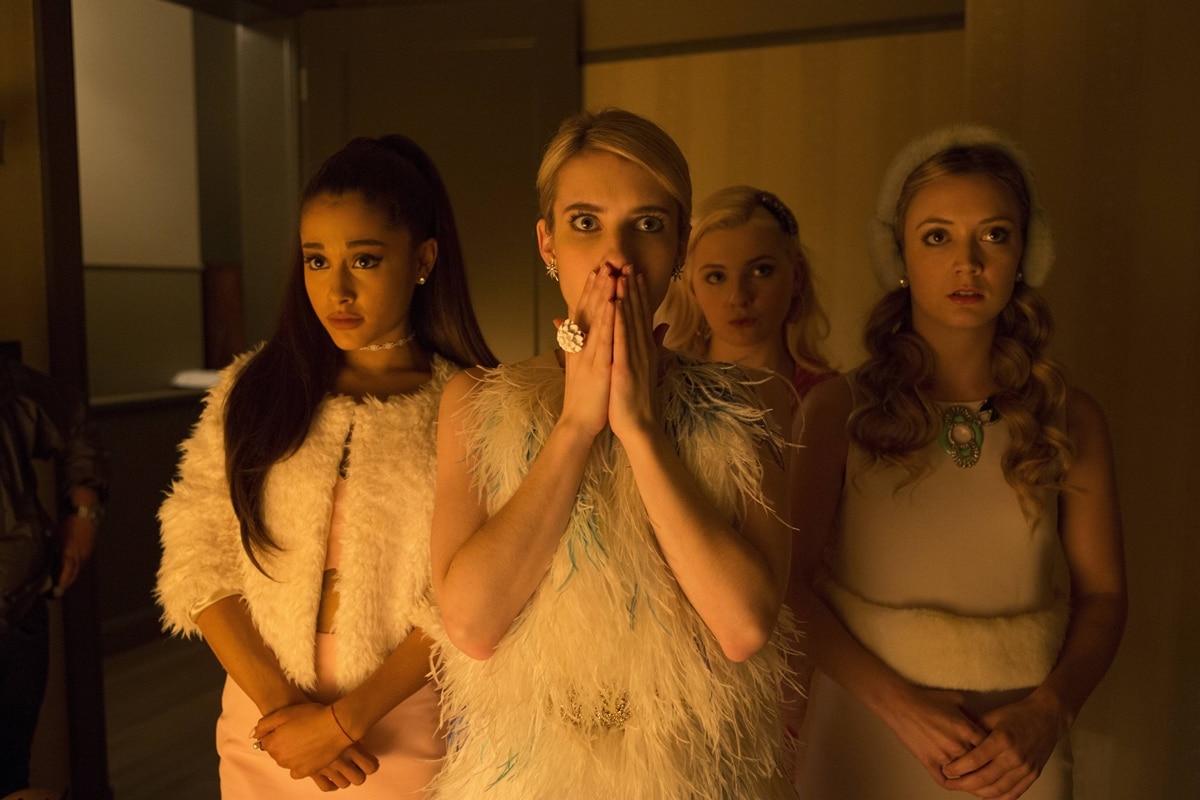 Abigail Breslin, Emma Roberts, Ariana Grande, and Billie Lourd step into their sorority alter egos—Chanel #5, Chanel Oberlin, Chanel #2, and Chanel #3—in Scream Queens, each styled in over-the-top pastel looks that defined the show’s camp-glam aesthetic