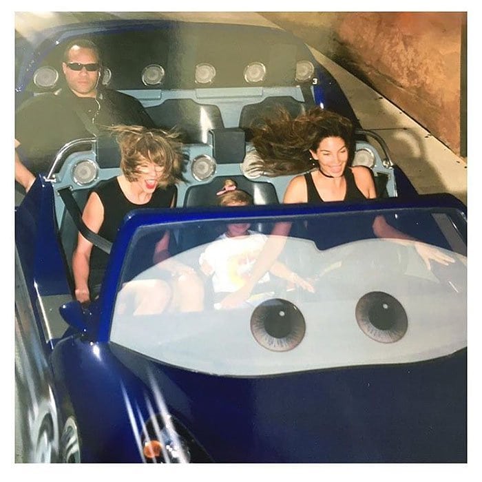 Taylor Swift's bodyguard appears unimpressed by the Cars rollercoaster at Disney California Adventure Park