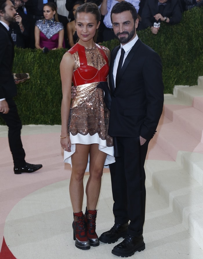 Louis Vuitton creative director Nicolas Ghesquière kept it sleek and modern in a tailored black suit and chunky lace-up boots, a minimalist counterpoint to Alicia Vikander’s futuristic ensemble