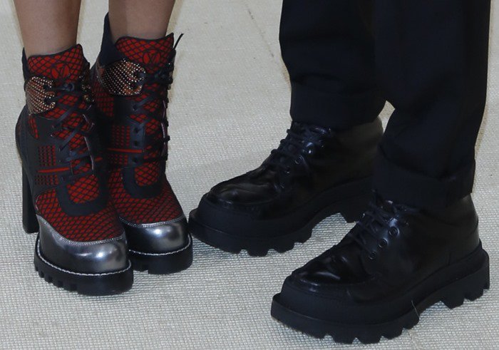 Alicia Vikander stepped into the Met Gala with futuristic red-and-silver lace-up Louis Vuitton boots, while Nicolas Ghesquière kept it sleek in chunky black lace-up shoes from the same house