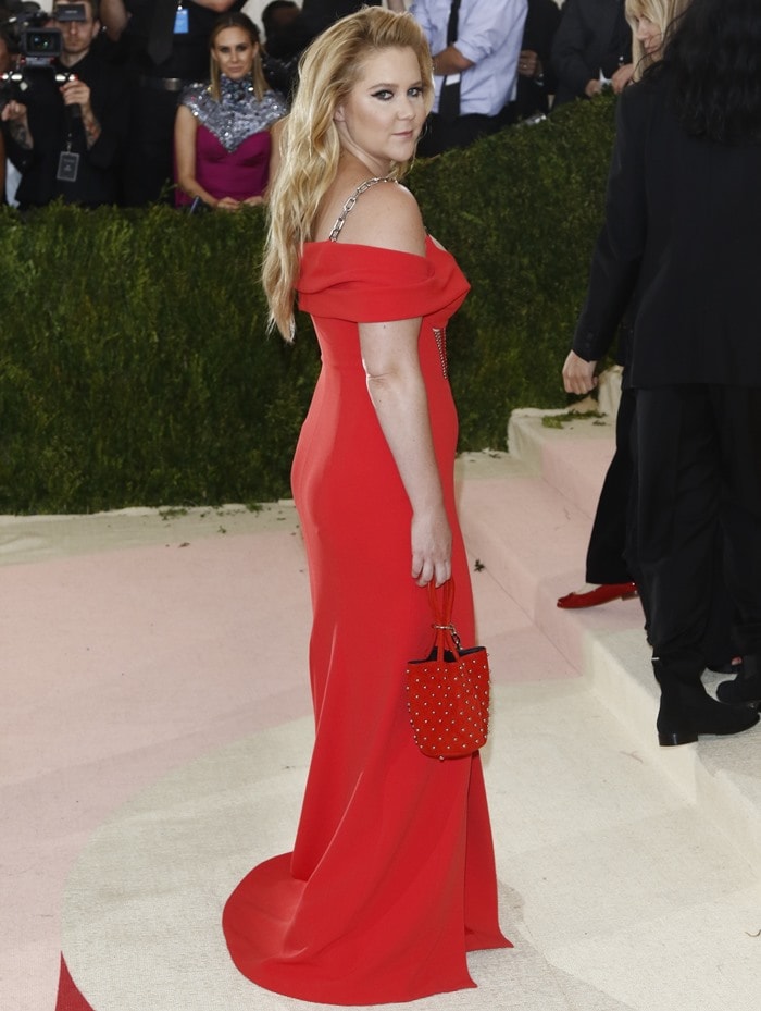 Amy Schumer wears a low-cut floor-length Alexander Wang dress to the Met Gala