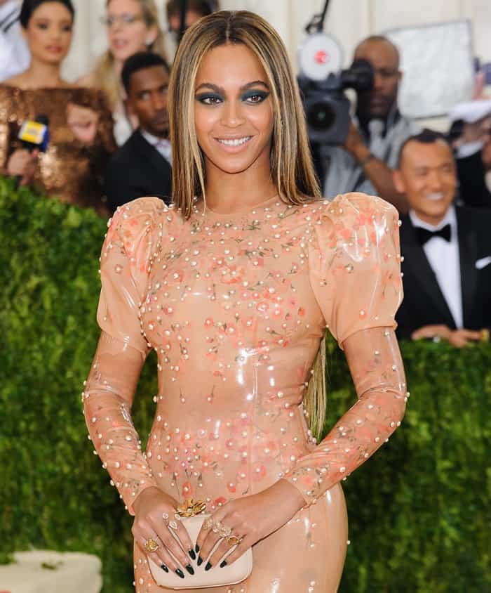 Beyoncé exudes elegance in her form-fitting, pearl-studded latex Givenchy gown at the 2016 Met Gala