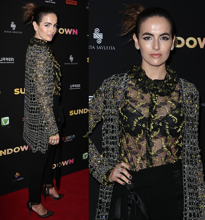 Camilla Belle strikes a poised red-carpet stance in a sheer Monique Lhuillier ensemble, with embroidered textures and a crystal net cardigan adding dimension