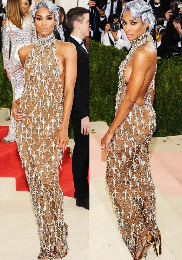 Ciara wowed at the 2016 Met Gala in a custom HM sheer chainmail gown paired with bronze satin Stuart Weitzman “Nudist” sandals, perfectly matching her futuristic silver hair