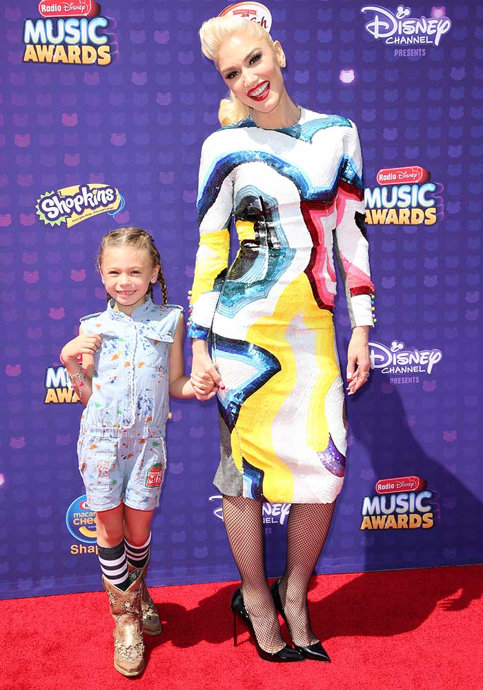 Gwen Stefani poses on the red carpet with her niece Stella Stefani in a colorful dress from self-taught fashion designer Olympia Le-Tan