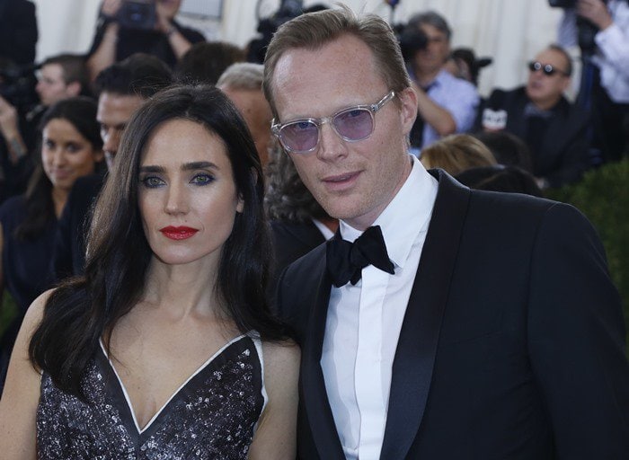 Connelly poses with husband Paul Bettany, who balanced her edgy look with a classic tuxedo and tinted sunglasses