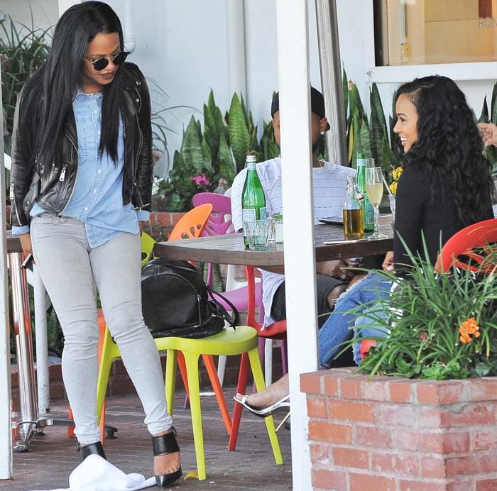 Christina Milian keeps it casual in denim and a leather jacket while sharing a lighthearted lunch at Mauro’s café in Los Angeles with her friend Karrueche Tran
