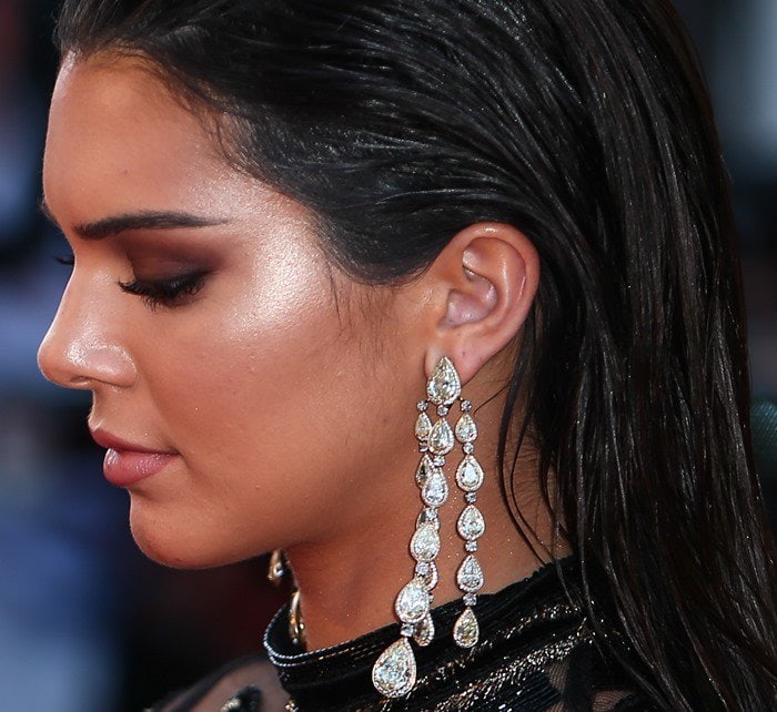 Kendall Jenner wearing statement gem-encrusted drop earrings from Chopard