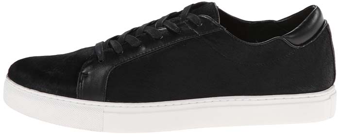 The black leather Kenneth Cole “Kam” sneaker offers a sleek monochrome take on the brand’s signature casual style, pairing a streamlined upper with a crisp white rubber sole for a polished everyday look