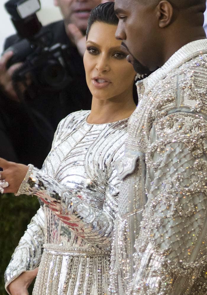 Kim Kardashian and Kanye West wear matching Balmain ensembles on the red carpet of the Met Gala
