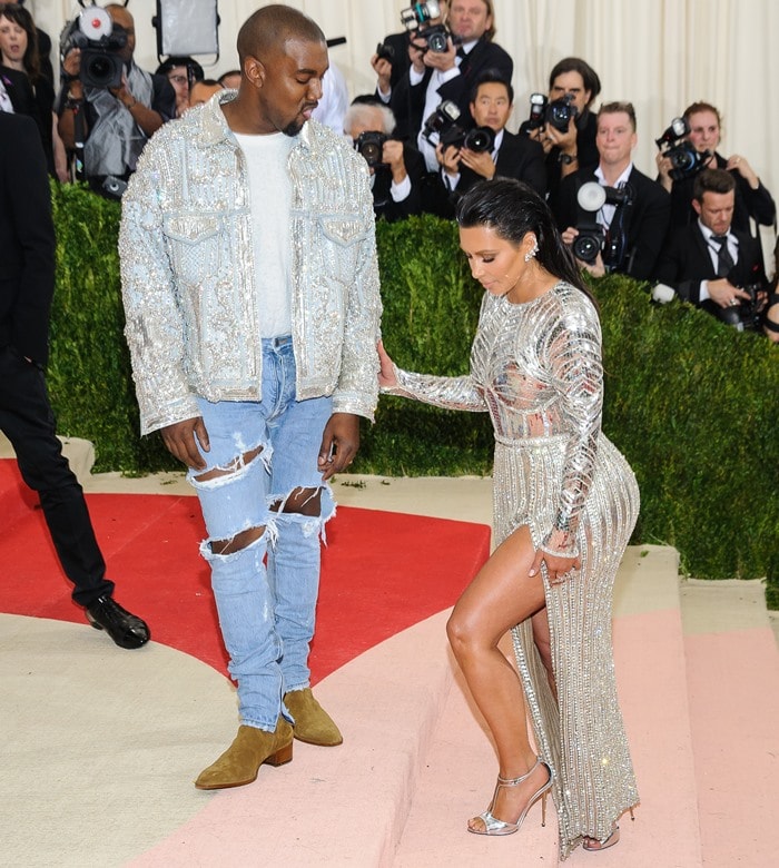 Kim Kardashian and Kanye West wowed in coordinated Balmain looks at the 2016 Met Gala, with Kim in a sparkling silver gown and matching heels, and Kanye in a bedazzled jacket, ripped jeans, and suede boots