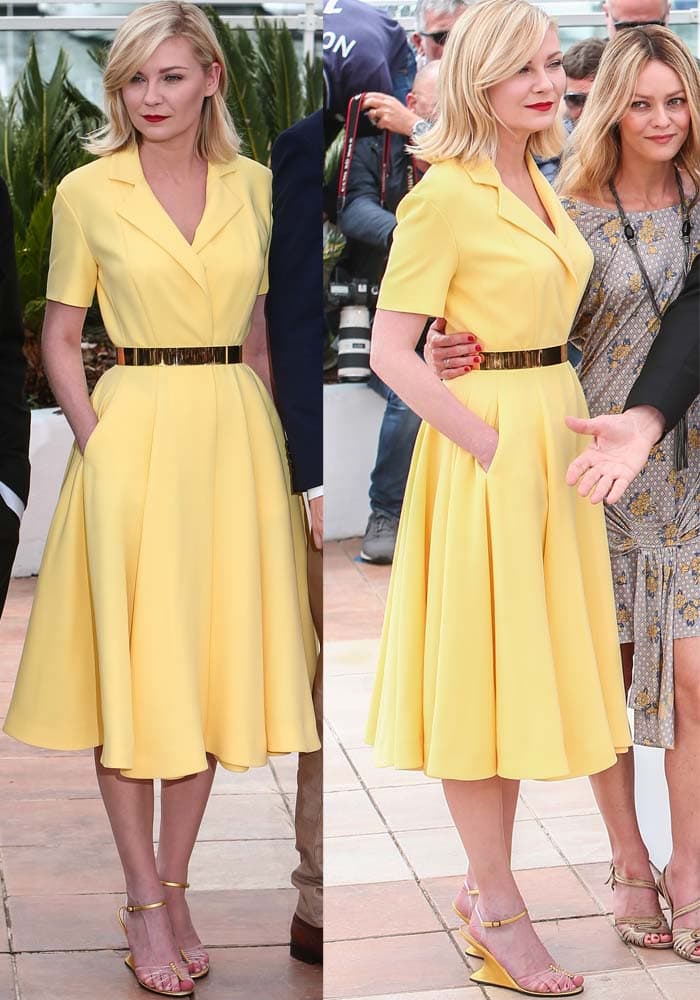 Kirsten Dunst brightened the Cannes photocall in a sunny yellow Dior Haute Couture dress cinched with a metallic belt, pairing it with Salvatore Ferragamo’s iconic “Invisible” wedge sandals