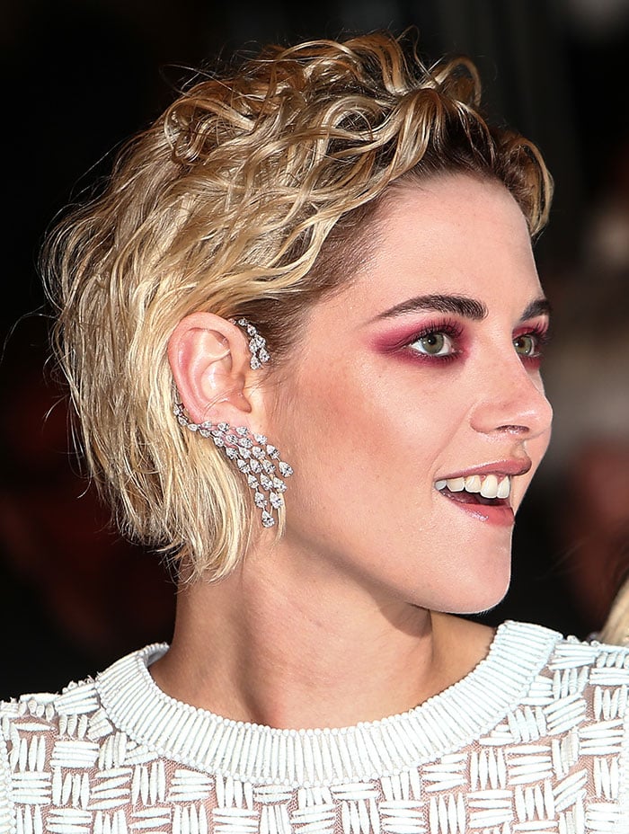 Kristen Stewart's short blonde hair styled in curls