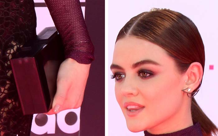 Lucy Hale accessorizes with a Rauwolf clutch, Kavant Sharart earrings, and Paige Novick rings