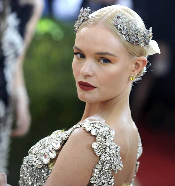 Kate Bosworth stuns in a jewel-encrusted Dolce Gabbana tiara crown, exuding regal elegance at the Met Gala