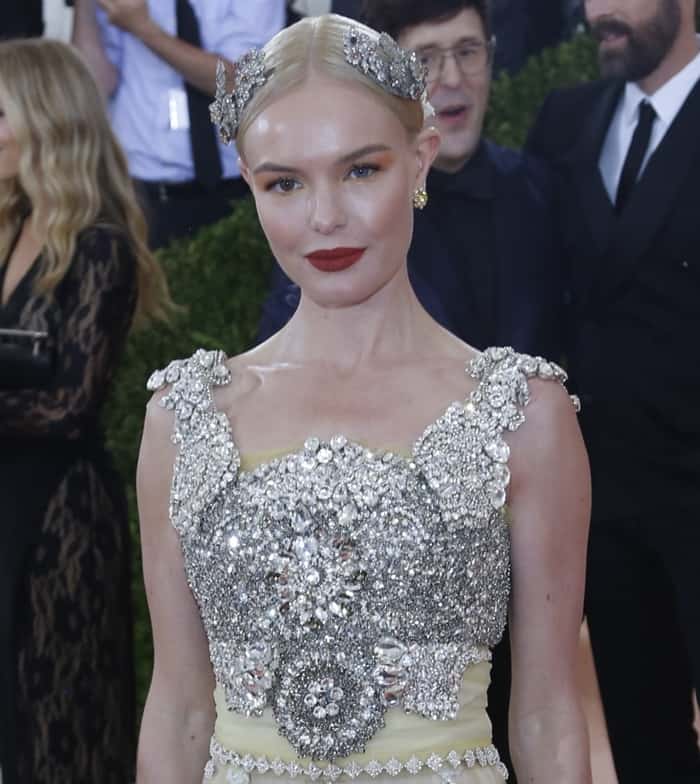Kate Bosworth wearing a Dolce Gabbana Alta Moda gown in tulle with crystal embellishment, silk ribbon, and glass pearls