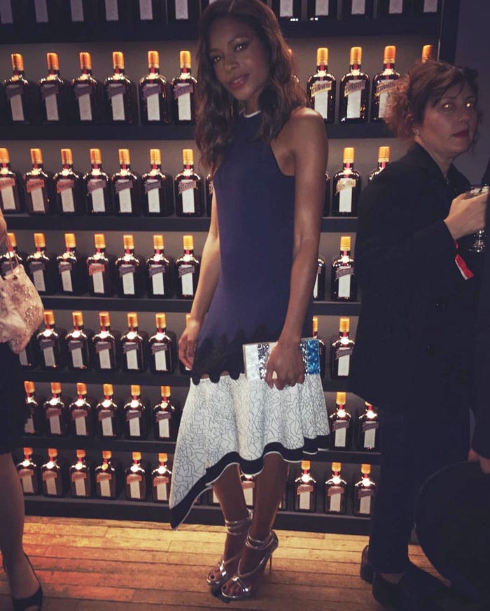 Naomie Harris shares a behind-the-scenes moment from the Cointreau Creative Crew Awards on social media, elegantly styled in Jonathan Simkhai and Giuseppe Zanotti heels, with the hashtag "#DreamDareCreate"