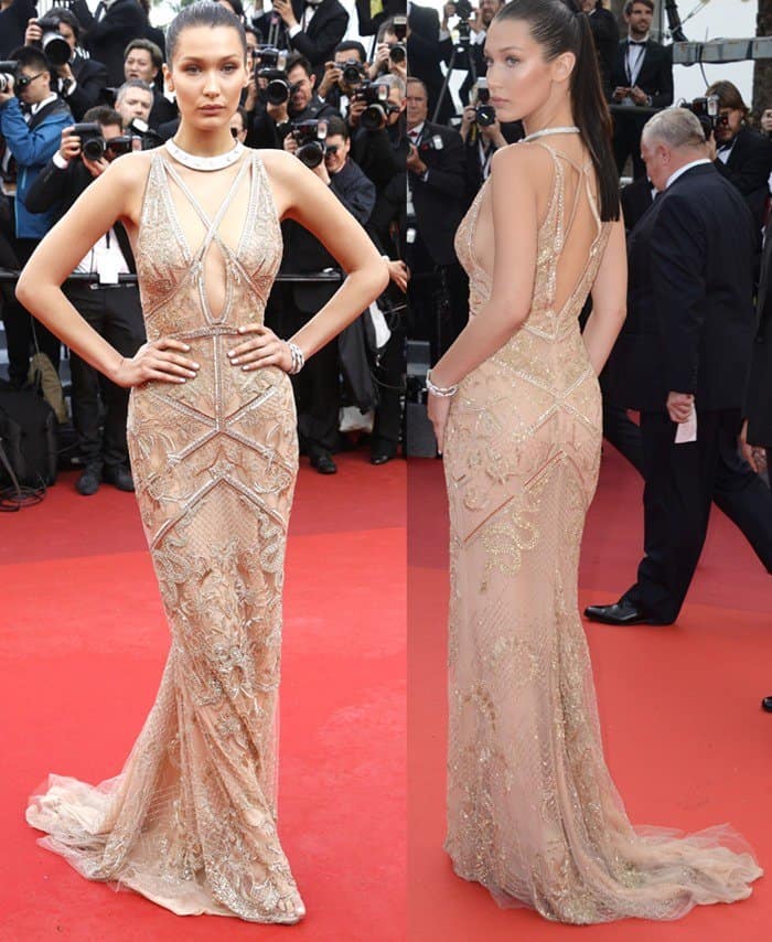 Bella Hadid stuns in a beaded nude Roberto Cavalli gown with intricate lace details and daring cutouts at the 69th Cannes Film Festival
