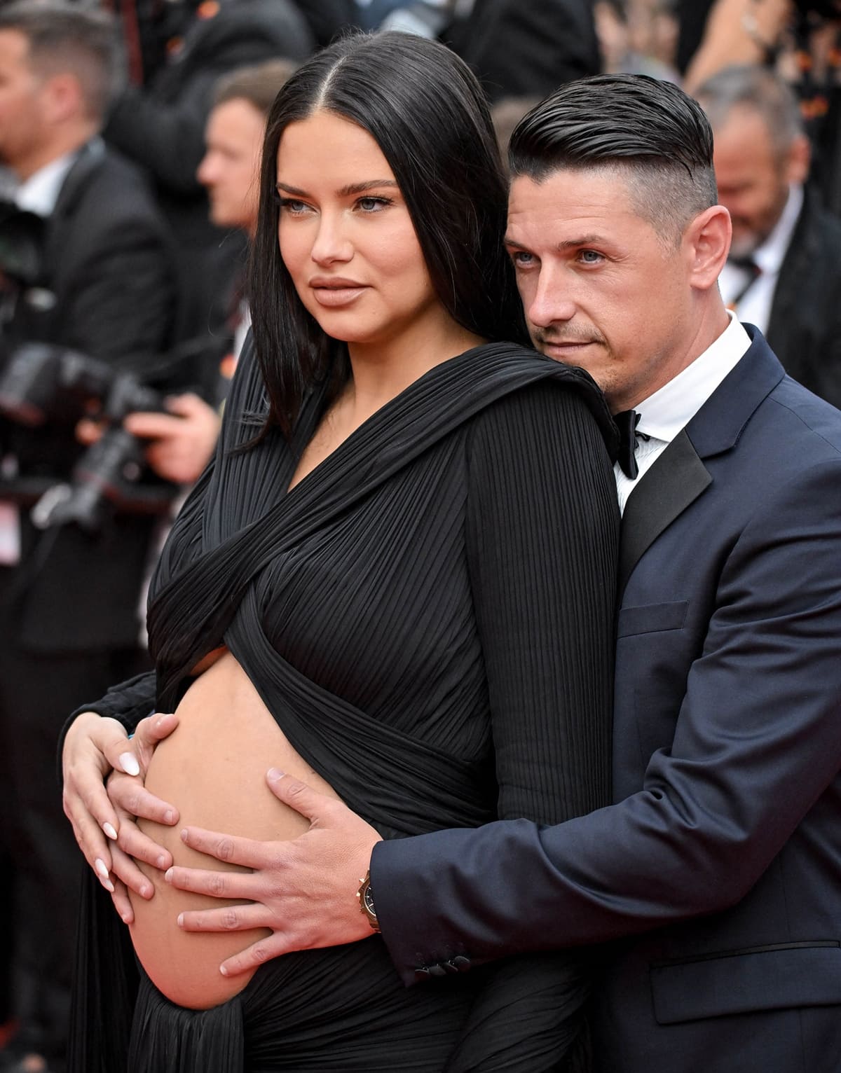 Andre Lemmers grabs his pregnant girlfriend Adriana Lima's belly at the screening of "Top Gun: Maverick"