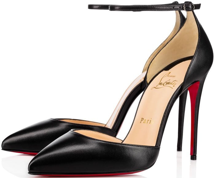 Christian Louboutin’s “Uptown” pumps deliver razor-sharp elegance with a pointed-toe d’Orsay silhouette, slender ankle strap, and sky-high stiletto, finished in smooth black leather with the house’s signature red lacquered sole for unmistakable Parisian polish