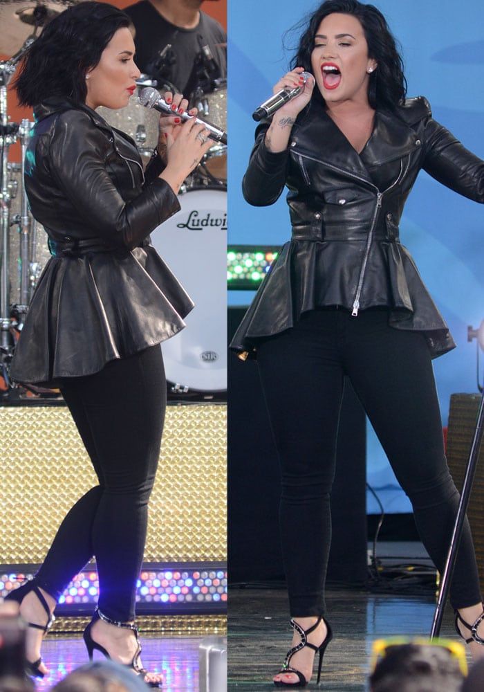 The sculptural peplum silhouette and sleek black skinnies create a streamlined stage look, allowing Lovato’s statement heels to anchor the outfit with high-fashion edge
