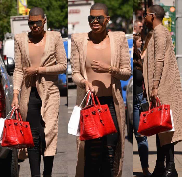 EJ Johnson turns heads in a nude mesh cardigan and ripped skinny jeans, elevating the look with a bold red Hermès Crocodile Birkin and towering black boots