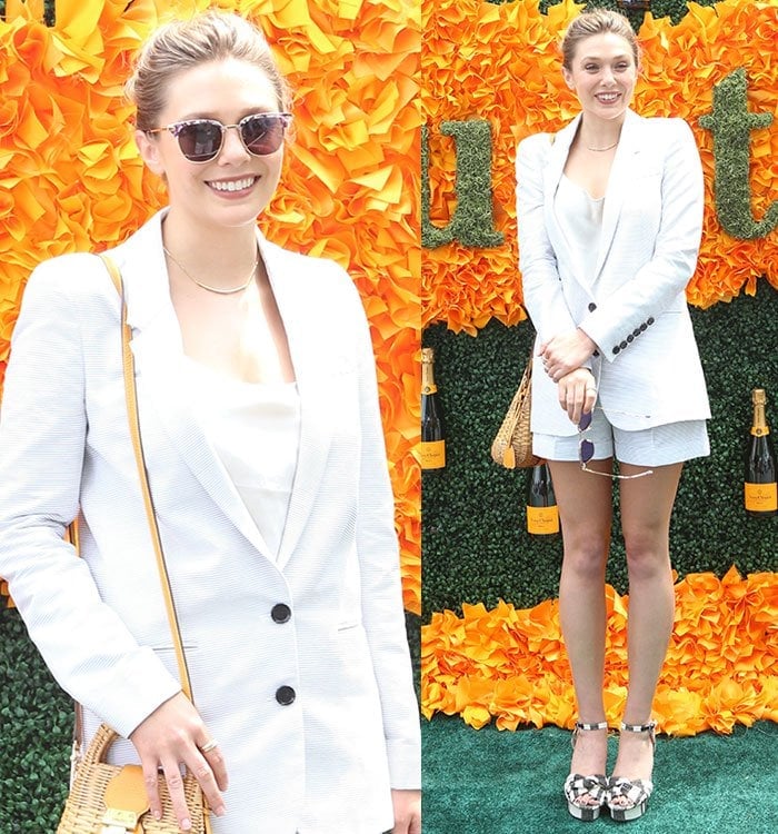 Elizabeth Olsen exudes relaxed sophistication in a white pinstripe Burberry short suit paired with Gentle Monster sunglasses and a wicker crossbody bag at the Veuve Clicquot Polo Classic