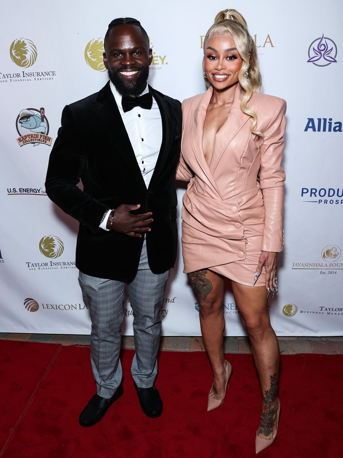 Eszylfie Taylor and Blac Chyna pose together on the red carpet at the 4th Annual Future Stars Charity Dinner Gala, with Chyna elevating her blush-toned blazer mini dress in nude pointed-toe pumps and sleek sculpted styling at the Taglyan Complex in Los Angeles on October 25, 2023