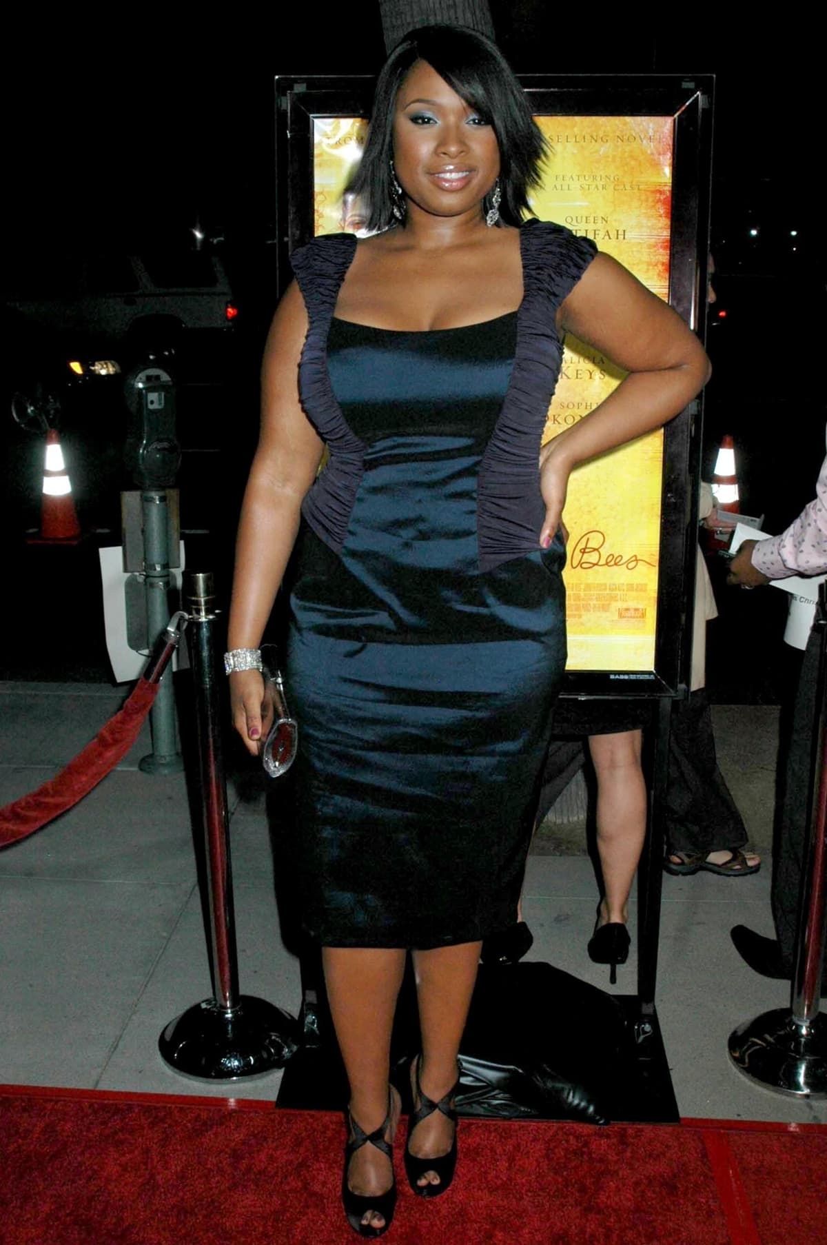 Jennifer Hudson exudes elegance in a form-fitting black dress and matching peep-toe heels at the premiere of The Secret Life of Bees
