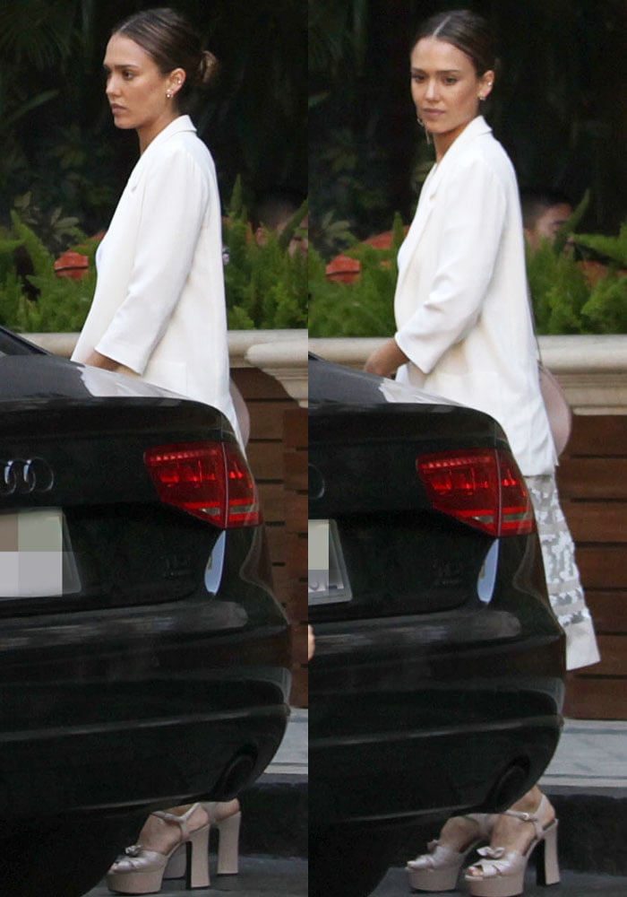 Jessica Alba pairs a white blazer and lace-accented skirt with her Saint Laurent “Candy” platform sandals in soft poudre satin, adding height and elegance to her neutral look