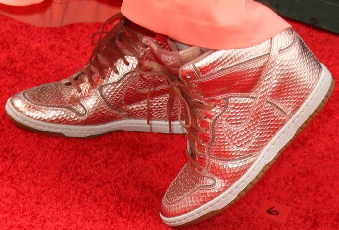 Katie swaps traditional heels for eye-catching metallic bronze Nike “Dunk Sky Hi” wedge sneakers