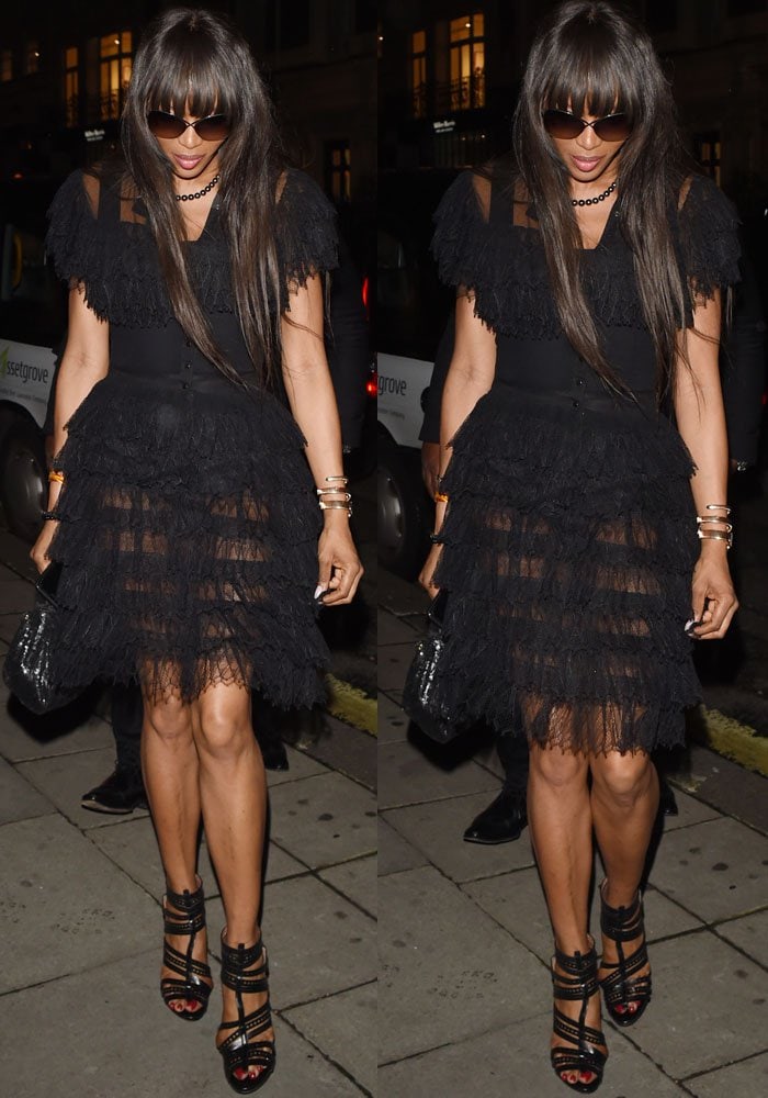 Naomi Campbell's sheer, ruffled Alaïa dress overwhelms her frame, with the mismatched sandals adding to an overall disjointed look